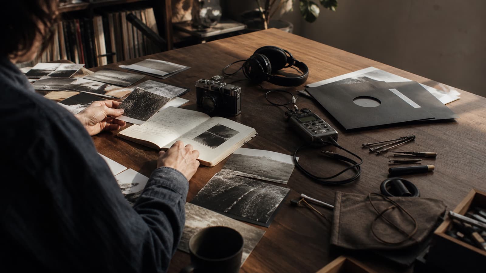 A creator reviewing photographs, audio tools, and notes at Captain's Studio
