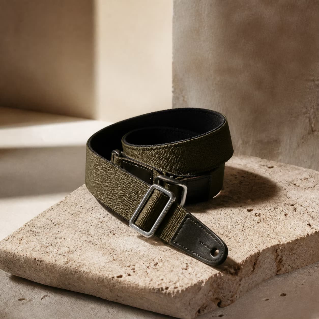 A practical carrying strap in warm window light